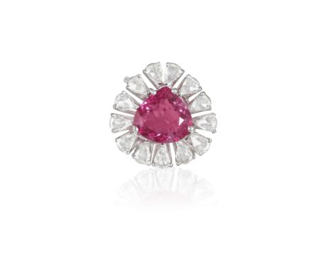 A RUBELLITE AND DIAMOND DRESS RINGComposed of a central pear-shaped rubellite tourmaline within a four-claw setting and a sur