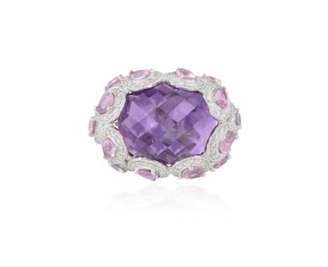 AN AMETHYST, COLOURED SAPPHIRE AND DIAMOND COCKTAIL RINGComposed of a central faceted sugarloaf amethyst within a surround of