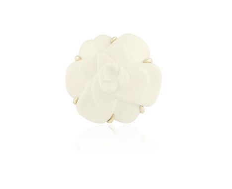 A FLOWER COCKTAIL RINGDesigned as an ivory coloured Camelia flowerhead (possibly white agate) within a six-claw setting, to a