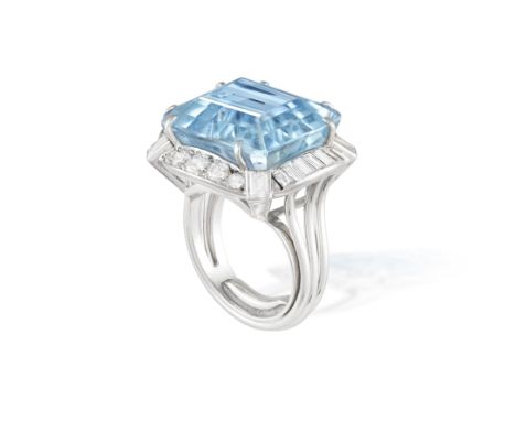 AN IMPRESSIVE AQUAMARINE AND DIAMOND COCKTAIL RING, MOUNTED BY CARTIER, CIRCA 1965The central cut-cornered rectangular aquama