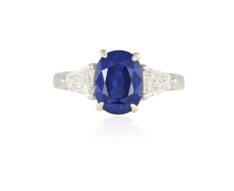 A SAPPHIRE AND DIAMOND DRESS RINGThe central oval-shaped sapphire weighing approximately 3.27cts within a four-claw setting, 