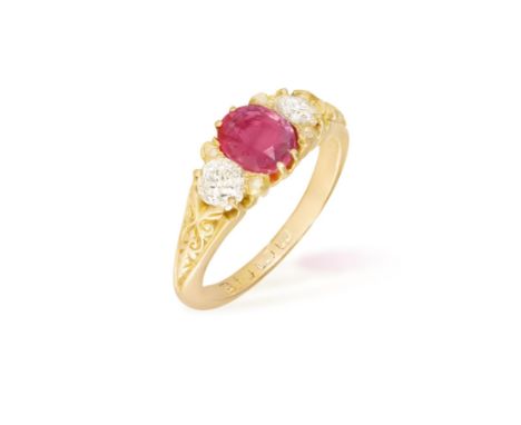 AN EDWARDIAN COLOURED SAPPHIRE AND DIAMOND THREE-STONE RINGThe central cushion-shaped pink sapphire weighing 1.15ct within a 