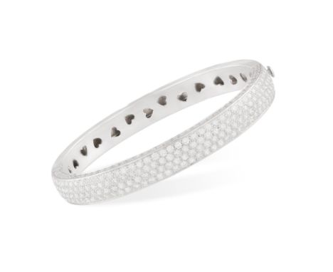 A DIAMOND BANGLEThe hinged bangle set with brilliant-cut diamonds to the front and borders, the inside hoop decorated with he