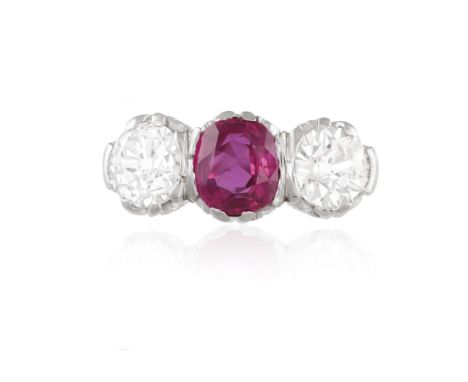 A FINE RUBY AND DIAMOND THREE-STONE RINGComposed of a central cushion-shaped ruby between two old brilliant-cut diamond shoul