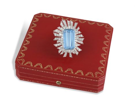 A MAGNIFICENT AQUAMARINE AND DIAMOND BROOCH, MOUNTED BY CARTIER, CIRCA 1965The elongated cut-cornered rectangular aquamarine 