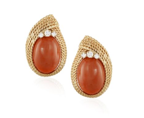 A PAIR OF CORAL AND DIAMOND EARCLIPSEach oval-shaped cabochon corallium rubrum coral within a ropetwist frames, accented with