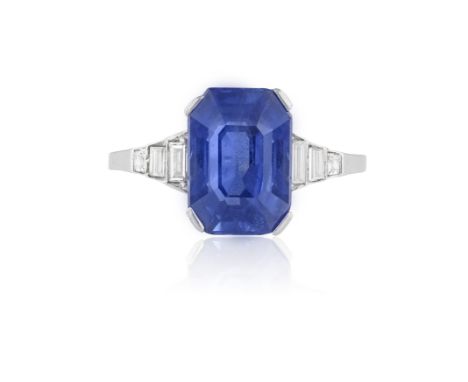 A FINE ART DECO SAPPHIRE AND DIAMOND RING, CIRCA 1920The elongated octagonal-shape sapphire weighing approximately 4.30cts, b