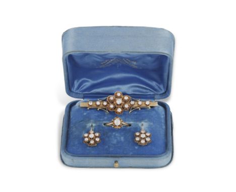 A LATE 19TH/EARLY 20TH CENTURY DIAMOND SET, CIRCA 1890-1900Comprising a brooch, a ring and a pair of earrings; the first desi