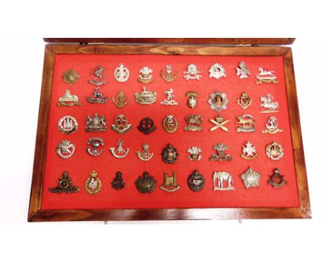 A BRITISH ARMY CAP BADGE COLLECTION  including those for the County of London Cyclists, Tyneside Scottish, 3rd Bn Monmouthshi