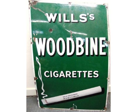 A WILLS'S WOODBINES CIGARETTES PICTORIAL ENAMEL WALL SIGN  with a smoking cigarette, and shaded white lettering against a gre