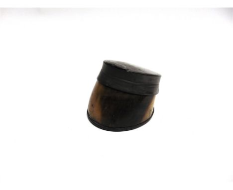 A HORSE HOOF SNUFF BOX the pewter top with a hinged lid, 13cm long.
