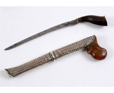 A MALAYSIAN OR INDONESIAN BADE BADE (KNIFE)  the 15.5cm slightly curved steel blade with a carved hardwood handle, in its sca