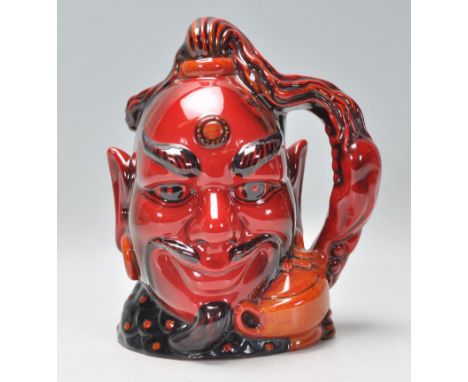A Royal Doulton flambe ceramic character jug in the form of Aladdin's Genie. No. D6971, limited edition number 968. Complete 