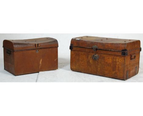 Two vintage mid 20th Century metal travelling trunks both retaining original brown paint work with locks to the front.&nbsp;