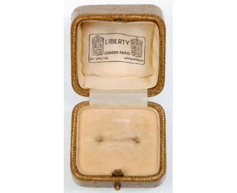 A vintage olive green leather and gold tooled ring box. Printed on the silk interior 'Liberty, London Paris, By Special Appoi