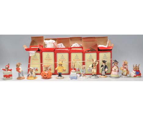 A group of twelve Royal Doulton Bunnykins ceramic rabbit figurines to include Christmas surprise DB 146 (signed), Sweetheart 