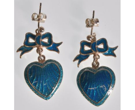 A pair of stamped silver ladies Georgian style drop earrings in the form of hearts with bows to the top, finished with blue e