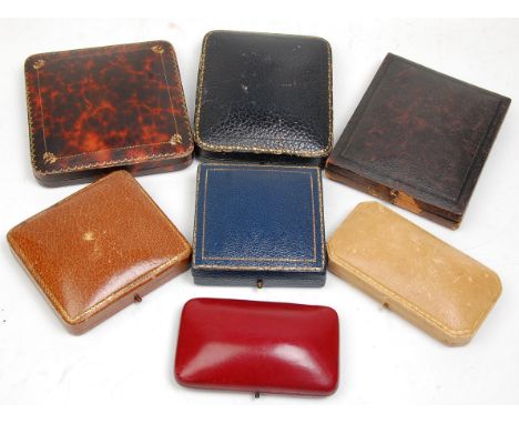 A mixed group of seven vintage jewellery boxes to include blue leather example with gilt tooled borders and makers mark for J