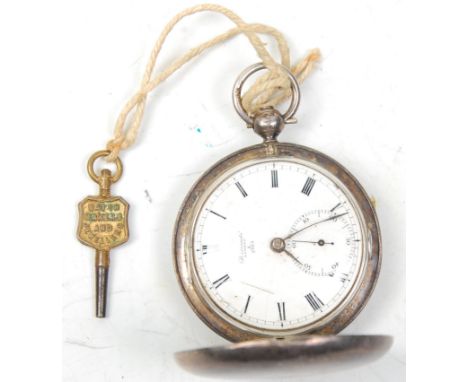 A 19th Century William IV silver full hunter pocket watch by Barraud's of London having a white enamelled face with roman num