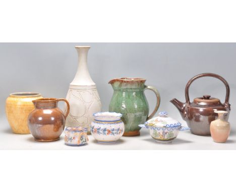 A collection of vintage retro 20th Century studio pottery to include a Buckfast Abbey ceramics green glazed jug, a Cygnet pot