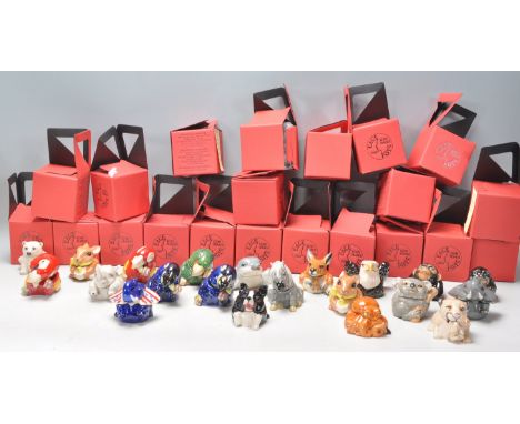 A group of twenty one Kevin Francis ceramic face pots in the form of various different animals to include four different parr