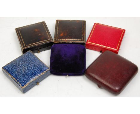 A good group of six vintage jewellery boxes mostly leather with gilt tooled decoration, a blue velvet example etc. Some still