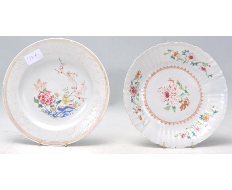 Two 19th Century Chinese famille rose plates, one having hand enamelled decoration featuring a perched bird, blossom and a pe