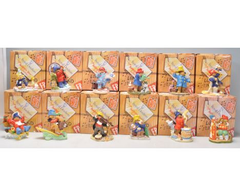 A good group of twelve Royal Doulton ceramic figures from 'The Paddington Bear Collection' to include 'At Christmas Time' PB9