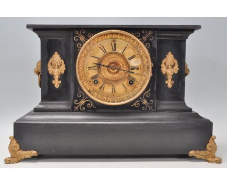 A Victorian 19th century marble and gilt metal 8 day mantel clock. The clock being raised on ormolu gilt metal legs with gild