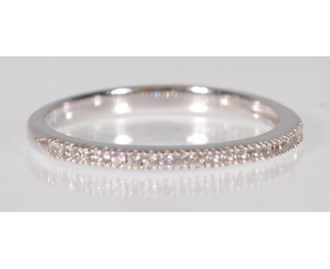 A stamped 14ct white gold half eternity ring set with round cut diamonds. Weight 1.6g. Size N.5.