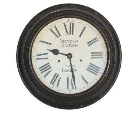 A 20th Century reproduction Victoria Station, railway London wall clock having a white face with roman numerals to the chapte
