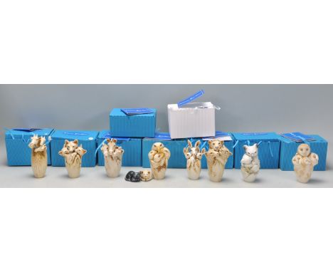 A collection of ten Adam Binder animals related netsuke style resin figurines to include giraffe, eagles, bunnies, wolfs, owl