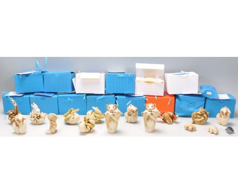 A group of sixteen Adam Binder carved resin netsuke style figures of the animal kingdom to include, snakes, bears, monkeys, t