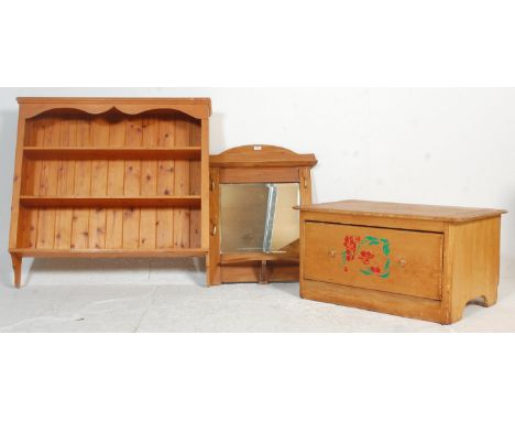 A Victorian style pine hanging shelf together with a Victorian pine wall mirror with shaped cornice and hooks either side of 