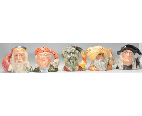 A group of five Royal Doulton ceramic character jugs to include Merlin D7117, The Witch D6893, the Fortune Teller D6874, the 