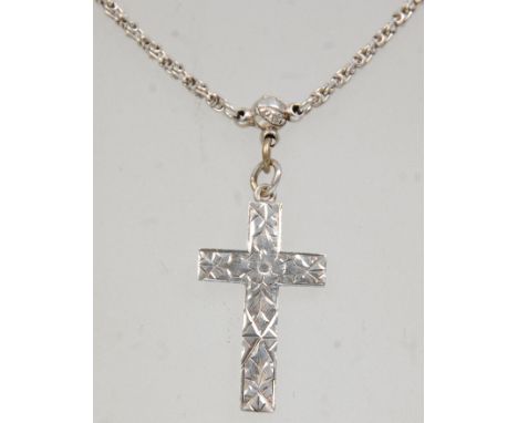 A good 19th Century Victorian silver cross pendant on a silver chain having a spring ring clasp. Stamped B&amp;W Stg. Total w