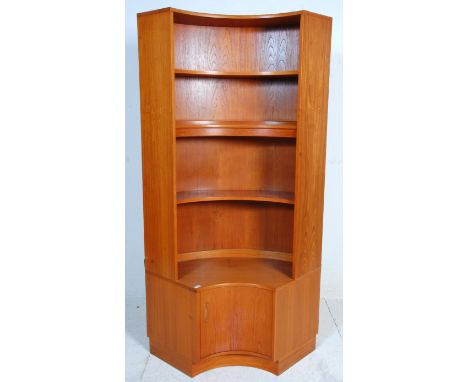 A vintage retro G Plan mid 20th Century teak wood curved corner wall unit book / display shelf having a cupboard base with sh