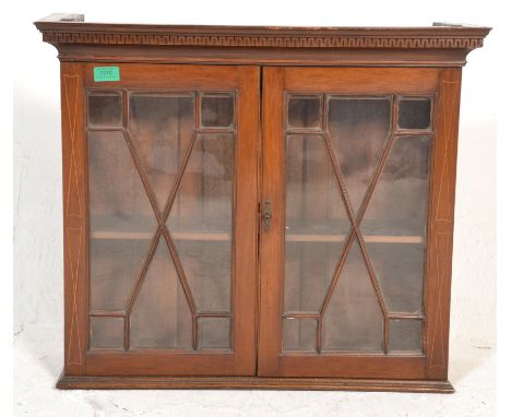 A 19th century Victorian mahogany and line inlaid astragal glazed hanging bookcase cabinet. Twin doors with inside shelf with