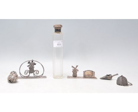 A group of silver items to include a silver topped scent bottle with a faceted glass bottle (hallmarked london 1910), a pair 