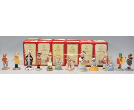 A group of twelve Royal Doulton Bunnykins ceramic figurines to include Sweetheart DB 130, Rainy Day DB 147, Lawyer Bunnykins 