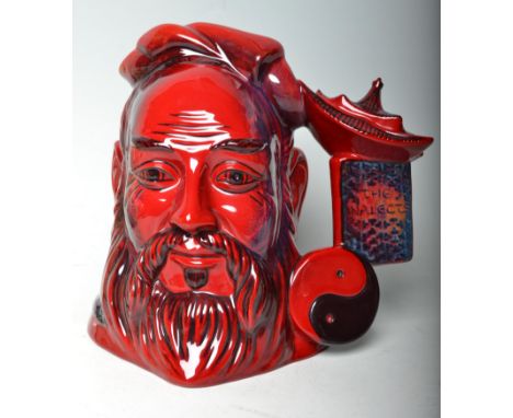 Flambe - A Royal Doulton ceramic Character / Toby jug Confucius D7003 in the Flambe pattern. Marks to base and being 482 / 17