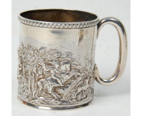 A late 19th Century Victorian silver hallmarked mug having repousse decoration depicting a medieval Hunting Scene with banded
