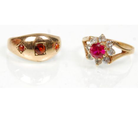 Two 9ct yellow gold ladies rings to include a gypsy ring set with three red stones. Hallmarked 375 for Birmingham date letter