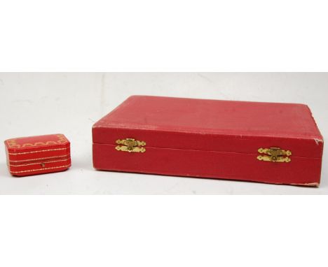 Two vintage red leather Cartier jewellery boxes to include and earrings box having gilt tooled lid and the other for a neckla