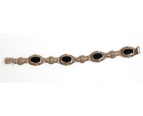 A good vintage 20th Century silver and marcasite ladies bracelet set with onyx set panels. Stamped 925. Gross weight 27.6g. M
