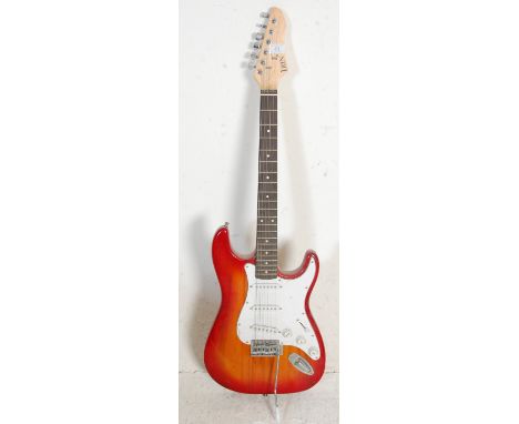 A vintage Irin electric Fender strat style guitar having a cherry burst body with a white scratch board with three single coi