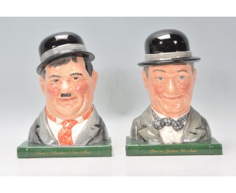 A pair of Royal Doulton ceramic Laurel and Hardy character book ends. Oliver Hardy No. 7120 and Stan Laurel no. 7119, limited