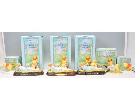 A group of six Royal Doulton ceramic figures from 'The Winnie The Pooh Collection' to include figures three editions of Summe
