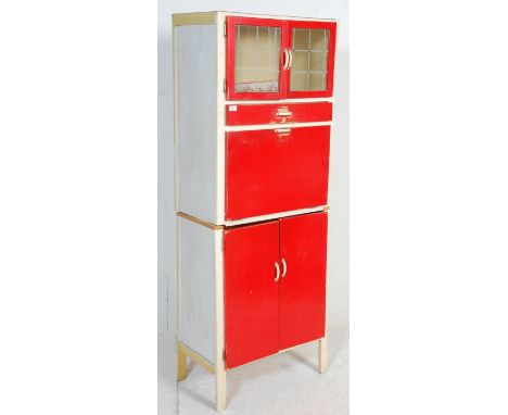 A vintage retro mid 20th Century 1950's kitchen unit having original red and white paint work, with a twin door cupboard base