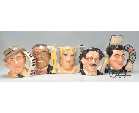 A group of five Royal Doulton ceramic character jugs from the celebrity collection to include Jimmy Durante D6708, Louis Arms